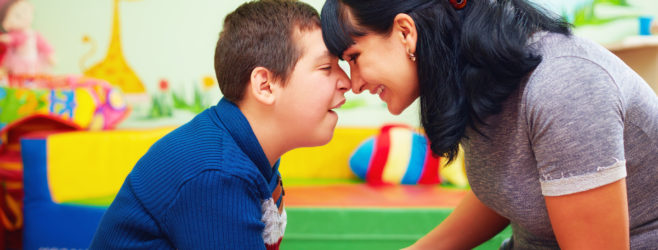 a child with cerebral palsy and his mother