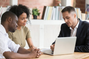 Lawyer meeting with a couple to discuss their case