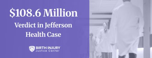 Mother gently holding and kissing her newborn baby, showing close bonding and care after birth.