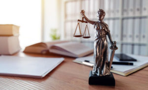 Small Lady Justice statue on top of a desk