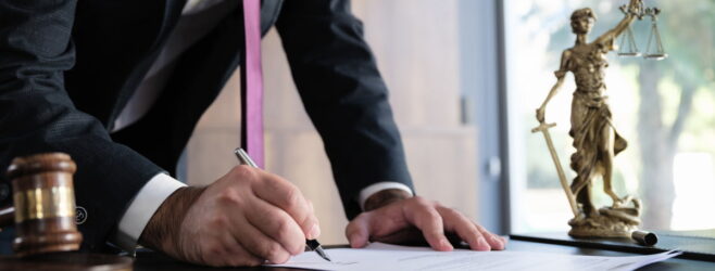 Lawyer signing documents