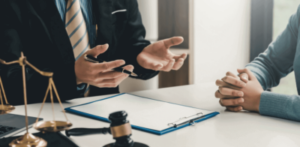 Two lawyers sit at a desk negotiating a cerebral palsy settlement.